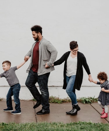 A family walking together holding hands